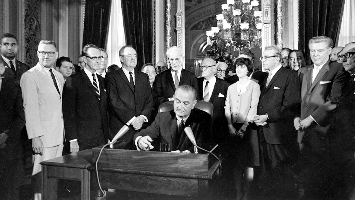 johnson signs voting rights act