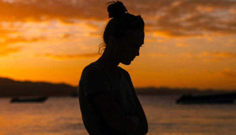 woman by water meaning of life photo